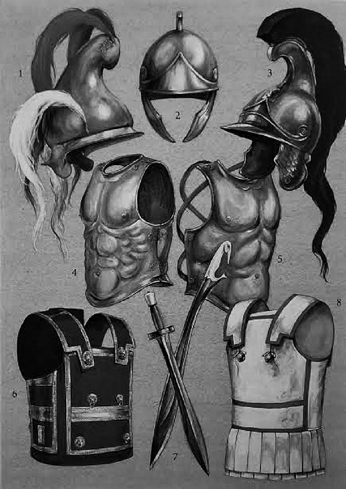 1. Fryygialaiskypärä, jonka sivulla on höyheniä ja laella harja. 2. Traakialaiskypärä, jossa on poskisuojukset ja kapea harja. 3. Rautainen "verginalaiskypärä", joka on fryygialaisen kypärän kaltainen, mutta ei suippene sen lailla harjaa kohti, vaan sen harja on suora ja kapea. 4. Pronssinen rintahaarniska, joka on kiinnitetty toiselta puolelta saranoilla. Kun haarniskaa sovitettiin sotilaan päälle, saranat lukittiin sokkatapeilla ja nauhat varmistivat rintahaarniskan. Se saattoi painaa jopa 13 kiloa. 5. Pronssinen puolihaarniska. 6. Rautahaarniska. 7. Kaksi miekkaa. Lyhyempi ja suorempi on ksiphos ja käyrempi on kopsis, jossa oli suojattu kahva. 8. Harjoituksissa käytetty linothorax eli pellavahaarniska, jossa oli kaksi kerrosta liepeitä (pteruges). 